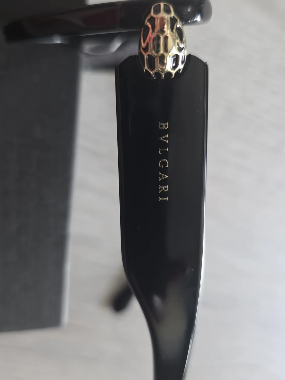 Bulgari Black Cat-Eye Sunglasses with Gold Accent